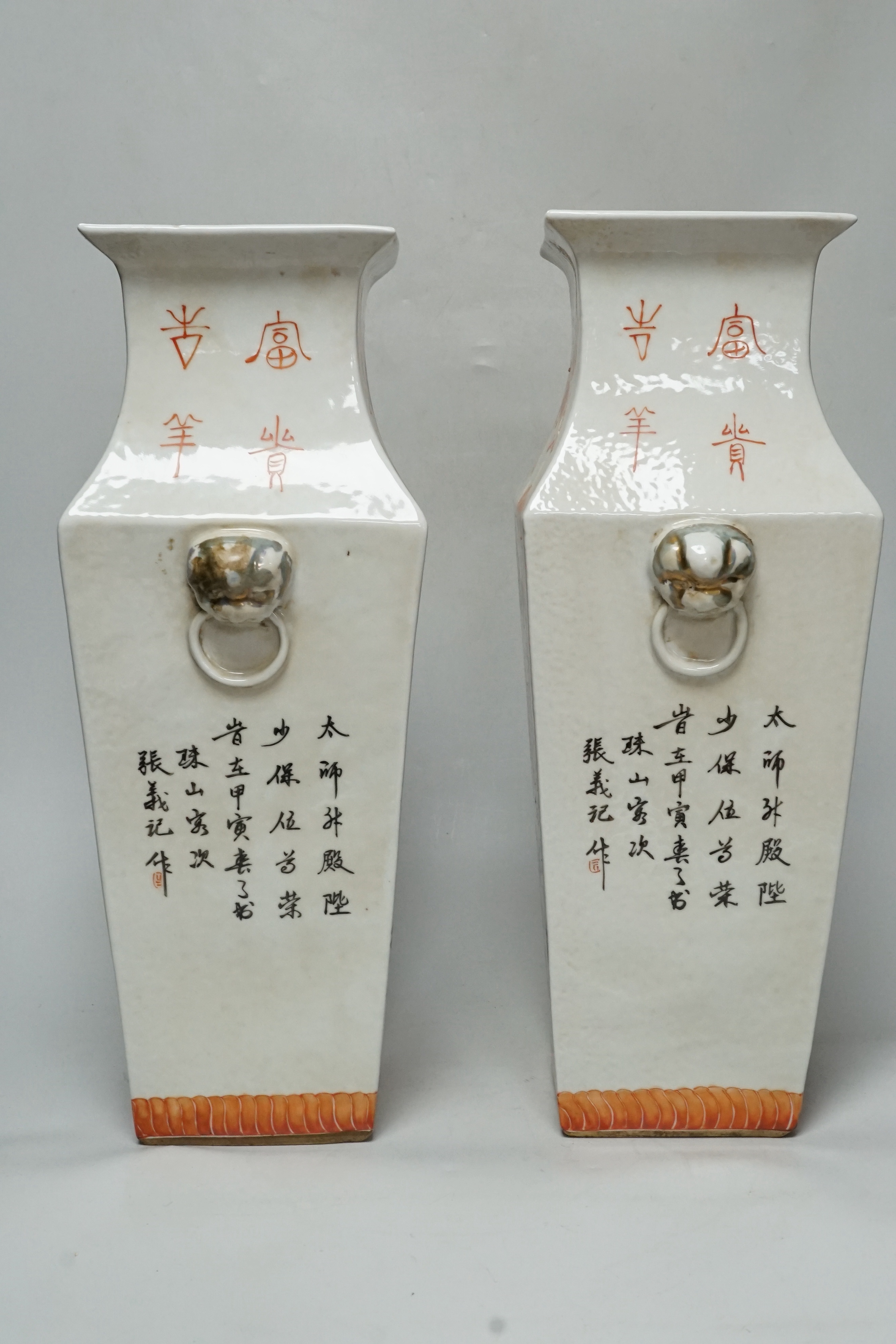 A pair of Chinese enamelled porcelain ‘fish’ square baluster vases, inscribed, 42cm high